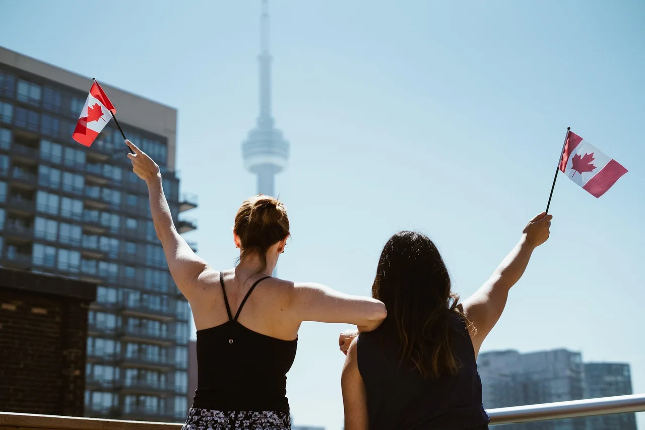 girls, women, people, canadian, flags, party, celebration, rooftop, patio, toronto, cn tower, sunshine, blue party, blue sunshine, blue celebrate, canadian, canadian, canadian, toronto, toronto, toronto, toronto, toronto, cn tower. Bill C-11 user generated content: what the rules cover