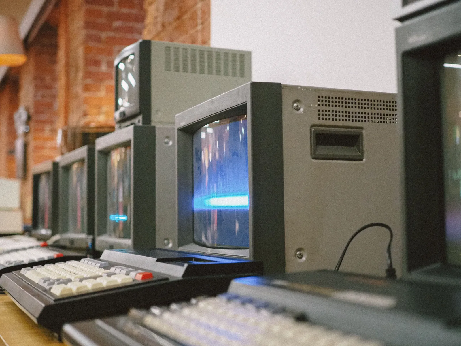 Row of vintage CRT computer monitors showcasing classic technology indoors. 7 lessons worth learning about early social networks statistics